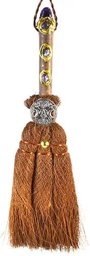 Druidic staff featuring gemstones, beads, and tassels, used in Celtic spiritual practices.