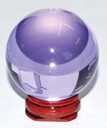 Crystal ball used in divination and spiritual practices, symbolizing clarity and insight.