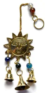 A Celtic sun and moon pendant with hanging bells and beads.