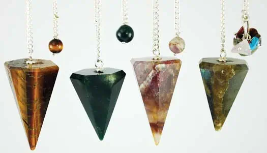 Stone pendulum set with various colored stones and chains for spiritual practices.