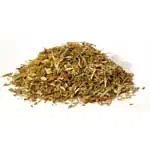 Dried herbal mixture, possibly for spiritual or medicinal use, on a plain background.