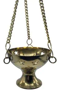 Bronze cauldron with hanging chains, used in Celtic spiritual practices and rituals.
