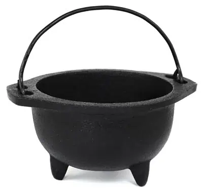 Small black cauldron with handle, used in Celtic spiritual practices and rituals.