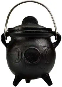 Black cauldron with handle, used in Celtic spiritual practices and nature veneration.
