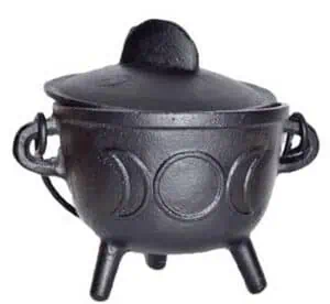 Black cauldron with three legs, used in Celtic spiritual practices and rituals.