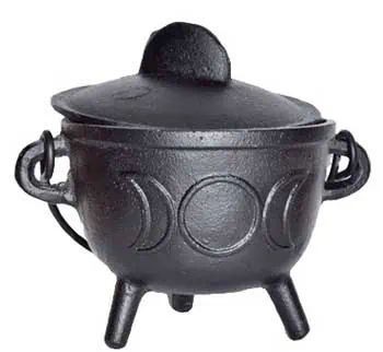 Black cauldron with three legs, used in Celtic spiritual practices and rituals.