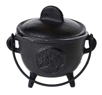 Cauldron with tree emblem, used in Celtic spiritual practices and rituals.