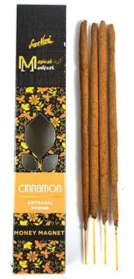 Cinnamon incense sticks in a decorative box, used for spiritual practices and meditation.