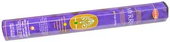 Celtic spirituality candle with symbols and natural motifs.