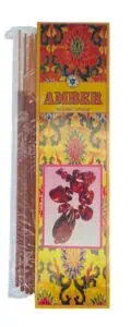 A package of amber-scented incense sticks with decorative packaging featuring Celtic-inspired patter.