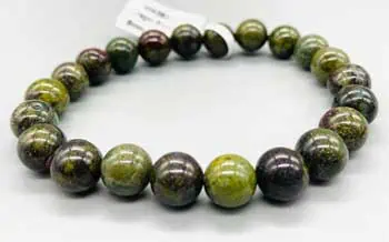 Bracelet made of green and black polished round stones.
