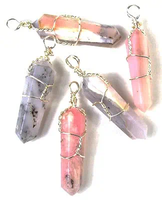 Healing crystal pendants with wire wrapping, featuring pink and gray stones.