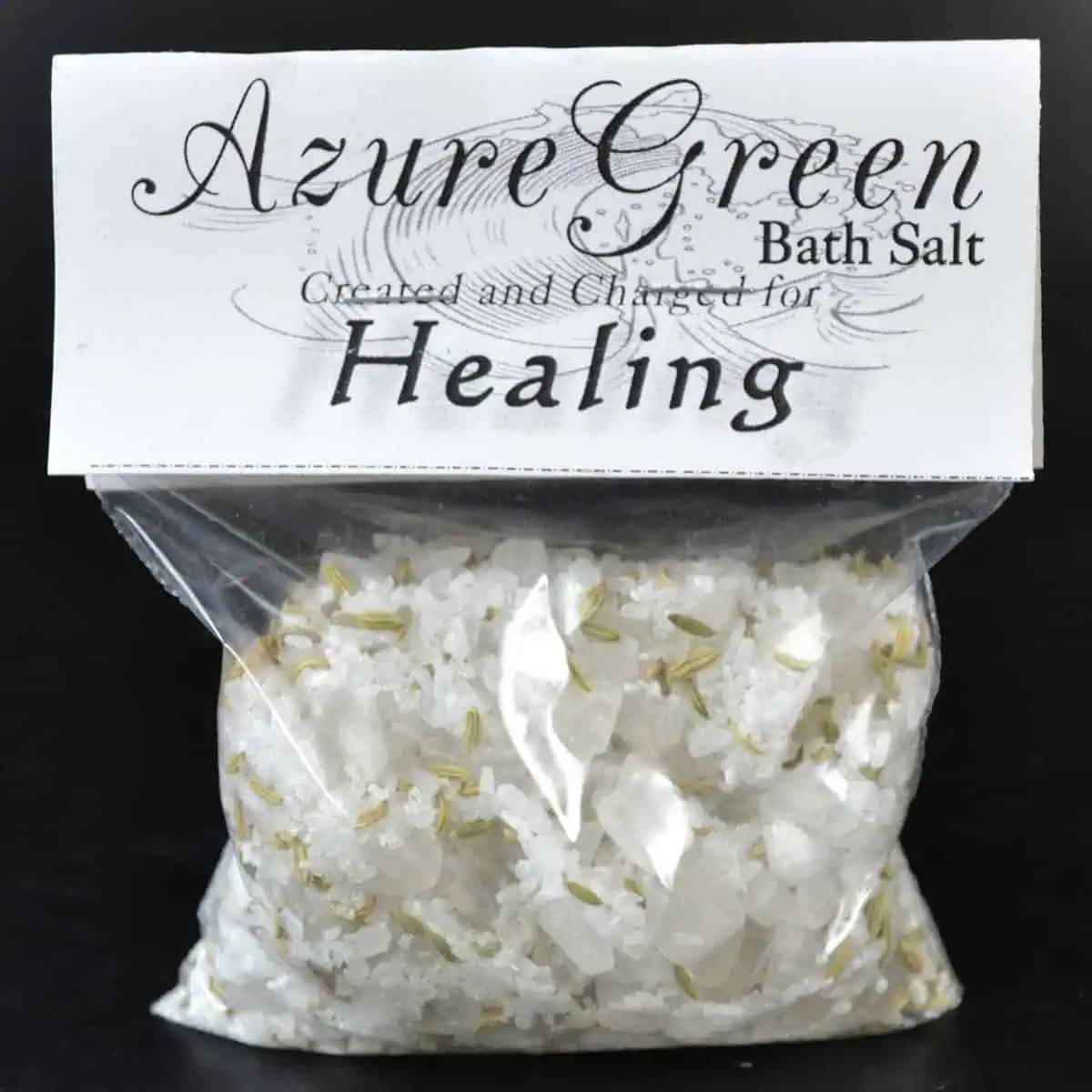 Bath salt with white crystals and gold-colored accents.