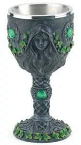 A detailed image of a Celtic-style chalice with green gemstone accents and intricate knotwork design.
