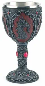 A detailed metal chalice featuring a dragon motif with red accents.
