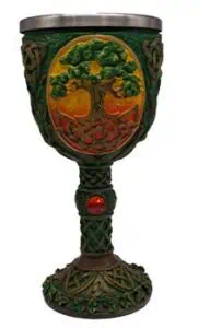 A Celtic-inspired goblet featuring a tree motif and intricate knotwork in green, yellow, and orange.