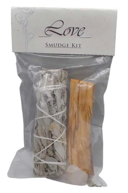 A smudge kit with sage and a wooden stick for cleansing and spiritual practices.