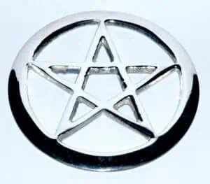 Metal pentacle pendant with star design, related to Celtic spirituality and nature veneration.