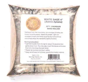 Bundle of white sage with label indicating 4-inch size, hand rolled, for spiritual cleansing.