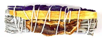 A wooden stick tied with white string, featuring natural materials, used in Celtic spiritual practic.