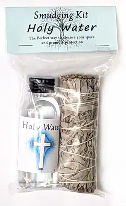 Holy water bottle and sage bundle for spiritual cleansing and protection.