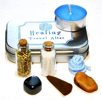 Small Celtic-inspired healing altar with candles, stones, and herbs for spiritual practice.