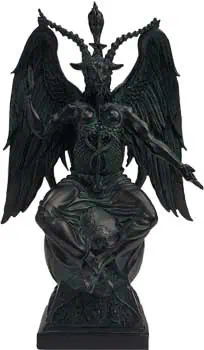 Statue of a Celtic deity with wings and horns, seated on a base.
