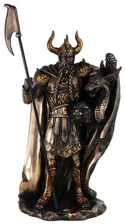 Celtic warrior statue with dragon and axe, representing Celtic spirituality and tradition.
